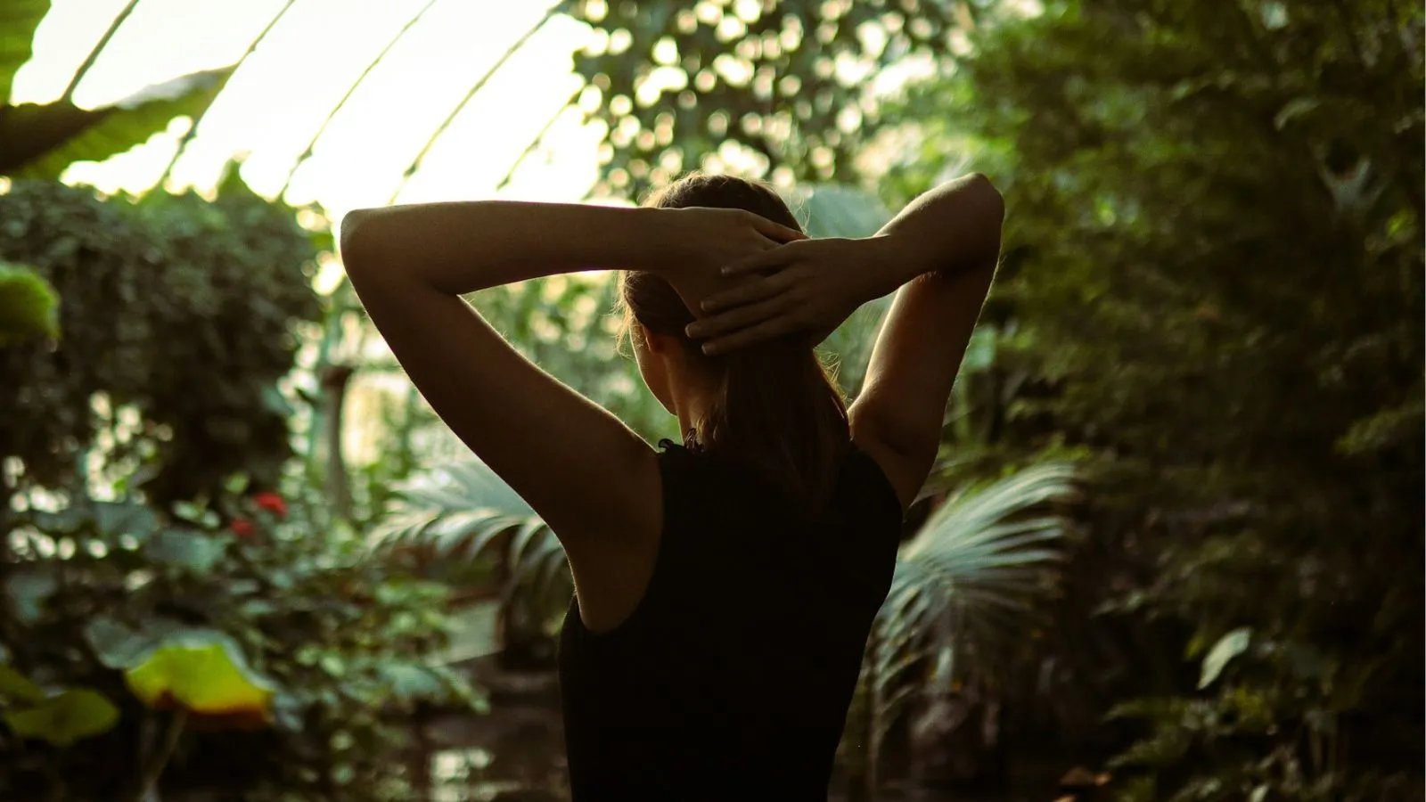 Person in a calm setting with tension in the neck and shoulders